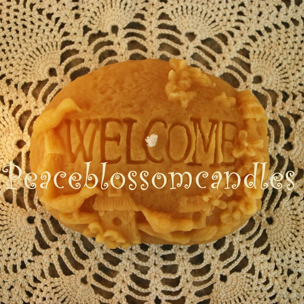 beeswax candle welcome rock